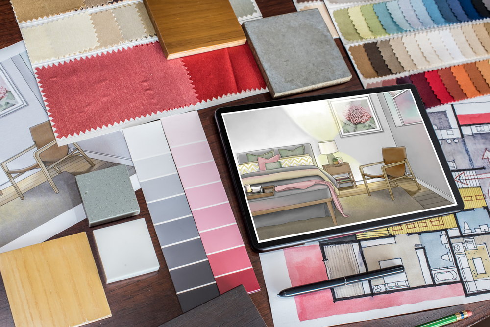 A collection of items representing the work of Home Creative, including architectural drawings, color swatches, fabric samples, and furniture sketches.