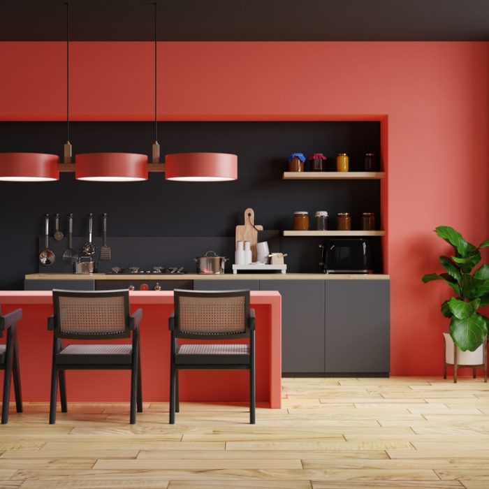 Modern style kitchen interior design with red and black wall